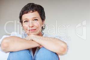 Attractive mature business woman. Attractive mature business woman smiling over plain background.