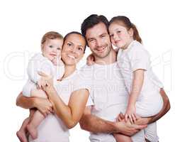 Portrait of togetherness. Cropped studio portrait of a loving family with two children dressed in casual wear.