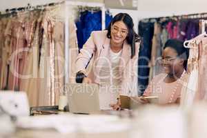 Need something for a special occasion Do not look further than our site. Shot of two women working together in a boutique.