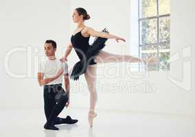 Her flow, his guide. Studio shot of a young couple rehearsing their routine.