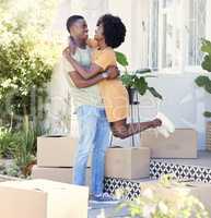 Its a joyous occasion. Shot of a young couple moving into their new house.