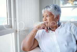 Thinking back.... Cropped shot of an attractive senior woman looking nostalgic while sitting in the old age home.