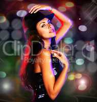 Glitz and glam. Shot of a sexy young woman posing in an evening dress and hat.