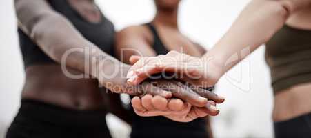 I want you to give it your best. Shot of a team of athletes with their hands stacked.