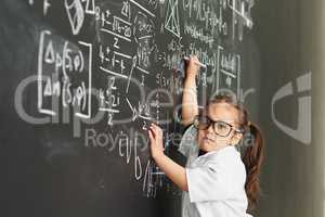 They make it just so easy for me. Shot of an academically gifted young girl solving a math equation.
