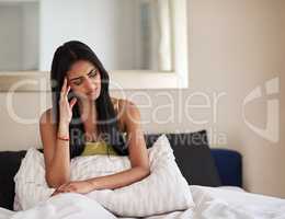 What could be causing these morning migraines. Shot of a young woman waking up in the morning feeling unwell.