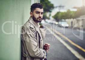 Style that takes its cue from city life. Portrait of a fashionable young man wearing urban wear in the city.