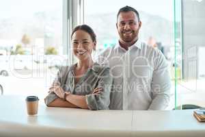 This is the dream team. Shot of a customer with her car salesman in the dealership.