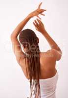 Its all about you. Studio shot of a woman with braids posing with her back towards the camera.