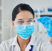 The maestro in modern medicine. Shot of a young scientist conducting an experiment in a laboratory.