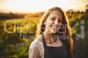 The simple life is the happy life. Portrait of a happy young woman working on a farm.