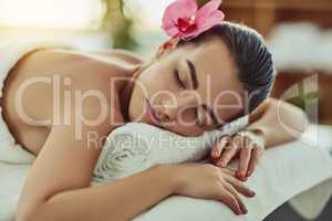 Nothing a day of beauty cant fix. Shot of an attractive young woman getting pampered at a beauty spa.