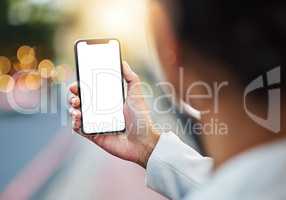 Its easy to have technology work in your favor. Closeup shot of an unrecognizable businesswoman using a cellphone with a blank screen in the city.