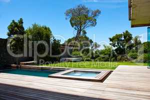 Modern living. A contemporary back garden with swimming pool.