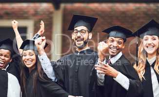 Celebrate every victory in your life. Shot of a group of fellow students standing together on graduation day.