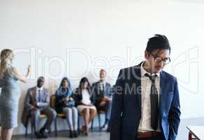 Today was not his day. Shot of a dejected job applicant leaving the waiting room after his interview.