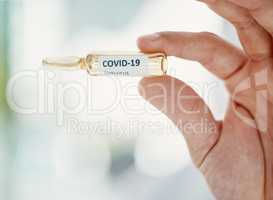 The coronavirus cure to the rescue. Cropped shot of a scientist holding an ampoule with 2019-nCov on it.