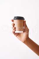 Coffee is what my therapist prescribed. Studio shot of an unrecognizable woman holding a disposable coffee cup against a white background.