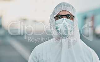 It's us versus the virus. Shot of a young man dressed in his protective gear before the decontamination process.