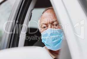 Looks like I'm next. Shot of a senior man waiting to get vaccinated at a drive through vaccination site.