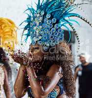 All this glitter is gold. Cropped shot of a beautiful samba dancer performing in a carnival with her band.