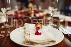 Your seat is reserved. Closeup shot of a place setting on a table during Christmas.