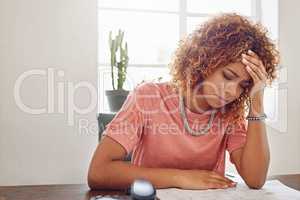 Great things never come from comfort zones. Cropped shot of a businesswoman looking stressed out at her desk.