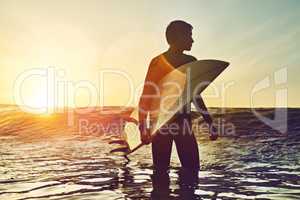 Guess whos on dawn patrol this morning. Shot of a young boy out surfing.