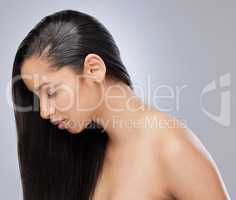 Its time for haircare. Studio shot of a beautiful young with with healthy brown hair.