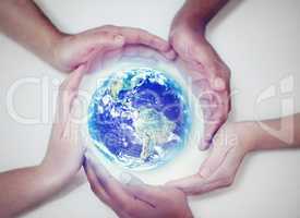 Together we can save our planet. A cropped view of human hands encircling the planet to protect it.