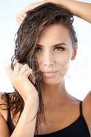Wet beauty. Closeup portrait of a beautiful young woman with wet hair.