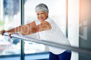 Fit is a fiddle. Shot of a senior woman working out indoors.