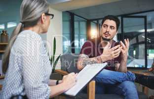 Give your feelings a voice. Shot of a young man having a therapeutic session with a psychologist.