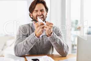 Today is not a good day. A handsome businessman crumpling paper in frustration over work stress.