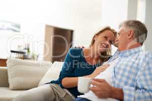 Every day is bliss when were together. Cropped shot of a mature couple relaxing together at home.