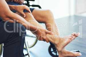 Recovery always starts with an assessment. Cropped shot of an unrecognizable male physiotherapist assisting a senior patient in recovery.