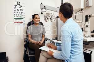 Is this the first eye test youve had. Shot of a young woman having an eye exam by an optometrist.