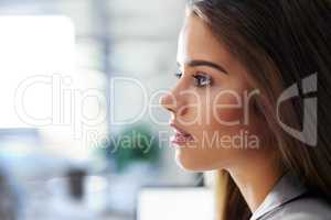 Your potential is greater than you would imagine. Profile shot of a confident young businesswoman in an office.