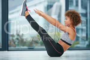 Prove to yourself that you have what it takes. Shot of a sporty young woman working out in a studio.