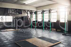 Get ready to transform your body. Sill life shot of the interior of a gym.