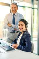 Were available 247. Cropped portrait of a female customer service representative and her supervisor at work in her office.