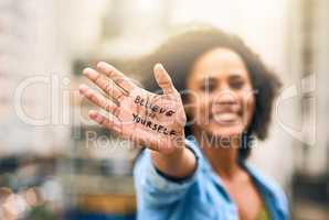 You can do it. Cropped shot of a woman showing a motivational message written on her hand.