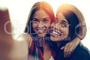 Selfies with my main chick. Shot of two young friends taking a selfie together outdoors.