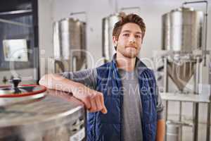 The master brewer himself. Portrait of a man working in a microbrewery.