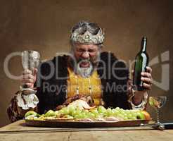 Im the life of the party. A mature king feasting alone in a banquet hall.