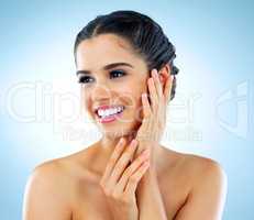 Theres no substitute for healthy glowing skin. Studio shot of a beautiful young woman with gorgeous skin posing against a blue background.