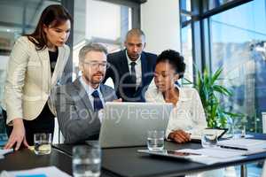 We have so much potential to improve our profits. Cropped shot of a group of business colleagues meeting in the boardroom.