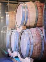 From those who know best. Shot of barrels of wine stacked on each other in a wine distillery.