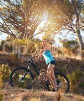 Mountain biking has so much to offer. Shot of a female cyclist out for a ride on her mountain bike.
