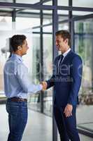 Partnering up to grow their dreams together. Shot of two businessmen shaking hands in an office.